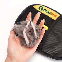 A handful of pet hair lifted off in one pass with the PawMitt